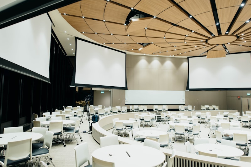 Grand tent reception with chandelier lighting at dusk